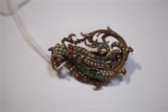 A late 19th/early 20th century gold and multi gem set brooch modelled as a Phoenix, 1.5in.